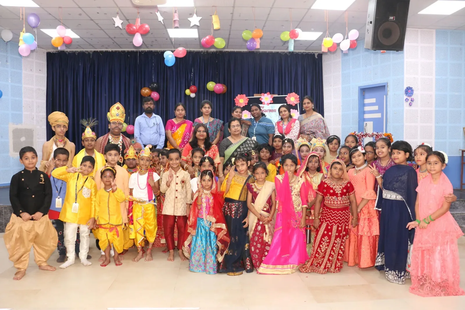 Students in traditional dress celebrating Janmashtami.
