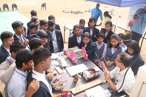 Students engineering microcontroller circuits and robotics prototypes.